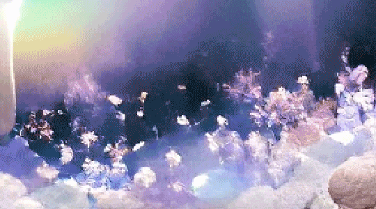 AI generated gif. simple shifting shapes that look like a small underwater crowd