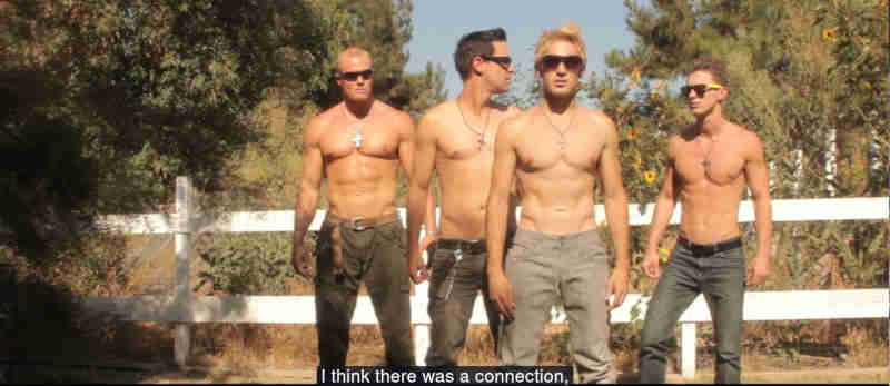 four somewhat muscular white men, wearing sunglasses, jeans and no shirts. caption reads 'I think there was a connection'